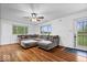 Open living room with neutral decor, wood floors, and plenty of natural light at 10456 N State Rd 267, Brownsburg, IN 46112