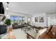 Inviting living room with hardwood floors, a cozy fireplace, and natural light at 10456 N State Rd 267, Brownsburg, IN 46112