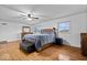 Large main bedroom with hardwood floors, natural light, and stylish furnishings at 10456 N State Rd 267, Brownsburg, IN 46112