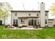 Spacious backyard featuring a concrete patio and comfortable seating, perfect for outdoor relaxation and entertaining at 12253 Bedrock Ct, Fishers, IN 46037