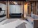 Unfinished basement features an exposed ceiling, with modern sofas and a carpet at 12253 Bedrock Ct, Fishers, IN 46037