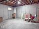 Unfinished basement with concrete walls and exposed ceiling, ready for customization at 12253 Bedrock Ct, Fishers, IN 46037