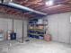 Unfinished basement features exposed ceiling, storage racks and concrete walls at 12253 Bedrock Ct, Fishers, IN 46037
