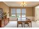 Inviting dining room featuring neutral walls, large windows, and classic chandelier at 12253 Bedrock Ct, Fishers, IN 46037