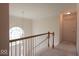 Bright hallway featuring a charming arched window, decorative light fixtures and neutral tones at 12253 Bedrock Ct, Fishers, IN 46037