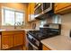 Modern kitchen featuring white countertops, stainless steel appliances, and a bright window at 12253 Bedrock Ct, Fishers, IN 46037