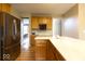 Open kitchen with stainless steel refrigerator, white countertop, and wooden cabinets at 12253 Bedrock Ct, Fishers, IN 46037