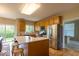 Bright kitchen with stainless steel appliances and center island with breakfast bar at 12253 Bedrock Ct, Fishers, IN 46037