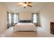 Spacious primary bedroom featuring a comfortable bed, stylish curtains, and ample natural light at 12253 Bedrock Ct, Fishers, IN 46037