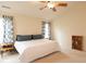 Spacious primary bedroom featuring a comfortable bed, stylish curtains, and ample natural light at 12253 Bedrock Ct, Fishers, IN 46037