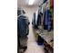 Walk-in closet with clothing, shoes and storage at 12253 Bedrock Ct, Fishers, IN 46037