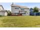 Two-story home exterior with a spacious backyard, deck, and ample natural light, with a detached garage at 12722 Moonseed Dr, Carmel, IN 46032