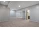 Spacious finished basement featuring neutral carpet, recessed lighting, and access to a bathroom and additional room at 12722 Moonseed Dr, Carmel, IN 46032
