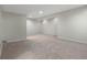 A finished basement with carpet flooring, recessed lights, and neutral paint at 12722 Moonseed Dr, Carmel, IN 46032