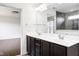 Modern bathroom featuring a double sink vanity, a large mirror, and a glass-enclosed shower at 12722 Moonseed Dr, Carmel, IN 46032
