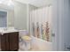 Bathroom with single vanity, shower-tub combo and neutral decor at 12722 Moonseed Dr, Carmel, IN 46032