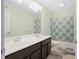 Bathroom with double vanity, shower-tub combo and neutral decor at 12722 Moonseed Dr, Carmel, IN 46032