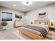 Relaxing bedroom boasts neutral tones, modern furnishings, and natural light from the window at 12722 Moonseed Dr, Carmel, IN 46032
