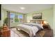 Comfortable bedroom with a large window and decorative artwork at 12722 Moonseed Dr, Carmel, IN 46032
