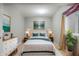 Bedroom featuring a plush bed, soft lighting, and stylish decor at 12722 Moonseed Dr, Carmel, IN 46032