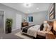 Bedroom with decorative light fixture, dark accents, and natural light at 12722 Moonseed Dr, Carmel, IN 46032