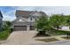 The home has an attached two-car garage and neutral-colored siding at 12722 Moonseed Dr, Carmel, IN 46032