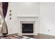 Cozy fireplace with a classic mantel, perfect for gathering and relaxation at 12722 Moonseed Dr, Carmel, IN 46032
