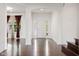 Bright foyer with hardwood floors, leading to living spaces filled with natural light at 12722 Moonseed Dr, Carmel, IN 46032