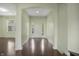 Light and airy foyer with wood floors and an arched doorway leading to the interior at 12722 Moonseed Dr, Carmel, IN 46032