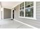 Inviting front porch featuring classic architectural details and a welcoming wreath at 12722 Moonseed Dr, Carmel, IN 46032