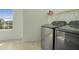 Laundry room featuring new stainless steel washer and dryer units at 12722 Moonseed Dr, Carmel, IN 46032