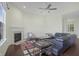 Spacious living room with a fireplace, modern furniture, and lots of light at 12722 Moonseed Dr, Carmel, IN 46032