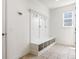 Bright mudroom with built-in bench, storage cubbies and coat hooks at 12722 Moonseed Dr, Carmel, IN 46032