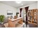 Home office featuring custom built-ins, a bright window, and ample workspace at 12722 Moonseed Dr, Carmel, IN 46032