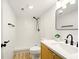 Modern bathroom with a white shower, a black shower head, a modern vanity, and sleek fixtures at 1337 N Concord St, Indianapolis, IN 46222