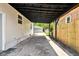 Long driveway leading to a detached garage with a wooden fence on the right side at 1337 N Concord St, Indianapolis, IN 46222