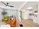 Bright living room showcasing hardwood floors, a tan couch, blue wall, and modern decor at 1337 N Concord St, Indianapolis, IN 46222