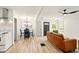 Spacious living room featuring a dining area, hardwood floors, and comfortable furniture at 1337 N Concord St, Indianapolis, IN 46222