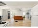 Open-concept living room with hardwood floors, a ceiling fan, and comfortable furniture at 1337 N Concord St, Indianapolis, IN 46222