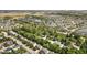 This aerial image captures a suburban landscape featuring homes, ponds, and lush tree coverage at 13765 Howe Rd, Fishers, IN 46038