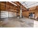 Interior of a barn featuring an open layout with concrete floors and unfinished wood walls at 13765 Howe Rd, Fishers, IN 46038