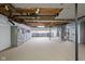Unfinished basement space featuring exposed ceiling, shelving, and storage at 13765 Howe Rd, Fishers, IN 46038