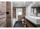 Stylish bathroom featuring wood-look tile, a soaking tub with shower, and a modern vessel sink at 13765 Howe Rd, Fishers, IN 46038