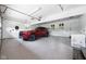 Clean, well-lit garage with epoxy flooring and ample space for parking and storage at 13765 Howe Rd, Fishers, IN 46038