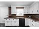 Cozy kitchen with white cabinets, black appliances, copper-trimmed countertops and a window view at 13765 Howe Rd, Fishers, IN 46038