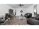 Bright living room with herringbone floors, ceiling fan, and modern furnishings at 13765 Howe Rd, Fishers, IN 46038