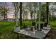Inviting outdoor patio featuring comfortable seating and surrounded by mature trees at sunset at 13765 Howe Rd, Fishers, IN 46038