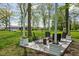 Inviting outdoor patio featuring comfortable seating and surrounded by mature trees at 13765 Howe Rd, Fishers, IN 46038