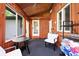 Sunroom with wood paneling and light filtering through the windows at 13765 Howe Rd, Fishers, IN 46038