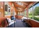 Cozy sunroom with wood paneling, skylights, and views of the backyard at 13765 Howe Rd, Fishers, IN 46038